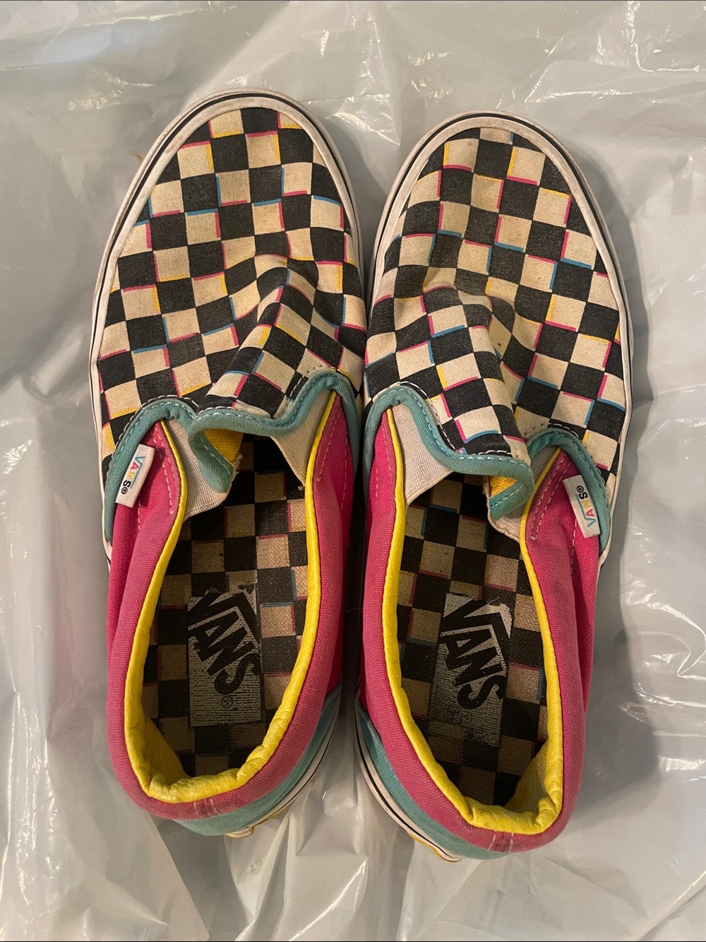 Vans women’s Checkerboard Slip-On Sneakers in Black, Pink & Yellow
